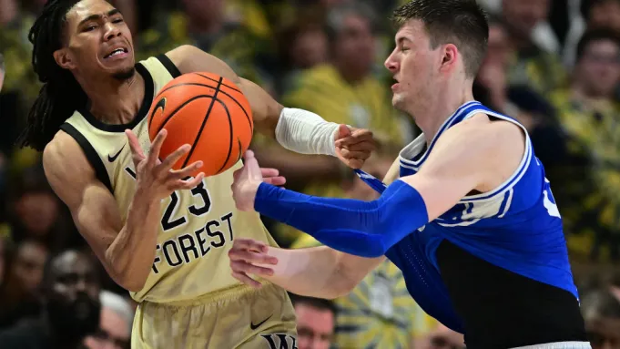 Duke basketball player injured after Wake Forest fans storm court following upset victory