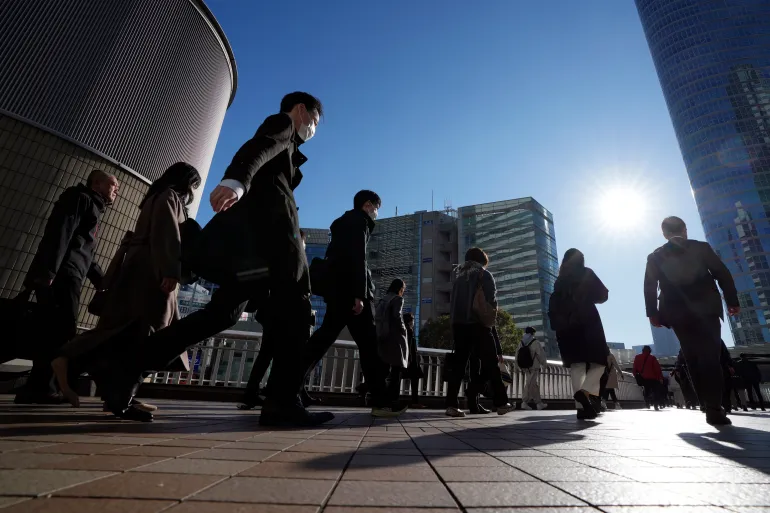 Japan avoids recession after quarterly economic growth data is revised up