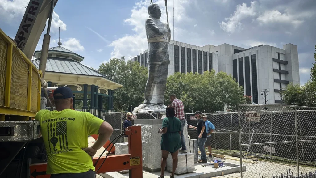 A large bronze statue of the late civil rights leader and Congressman John Lewis