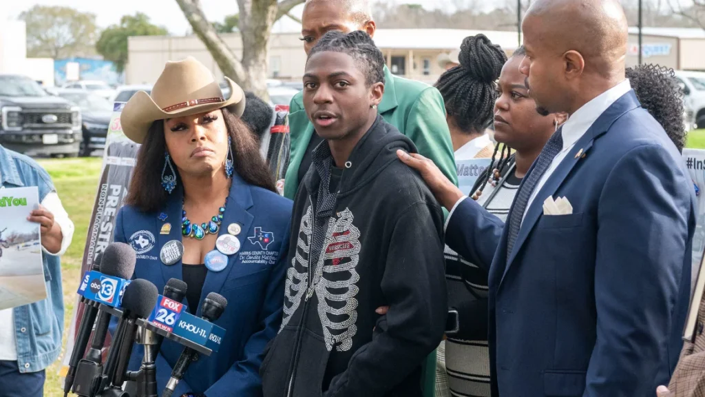 Dr. Candice Matthews, left, listens as Darryl George