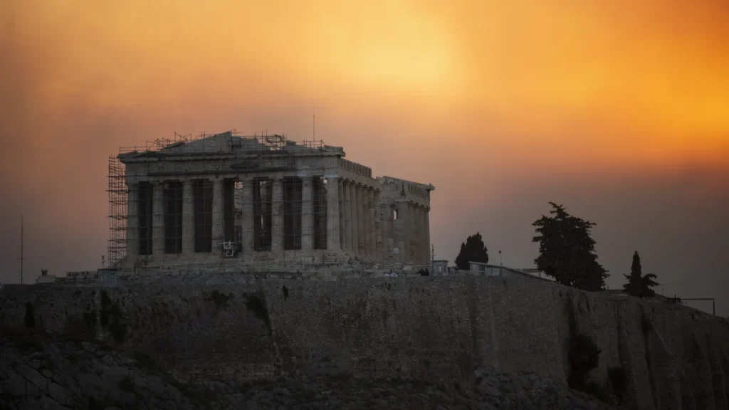 Fires rage in the hilltops behind the Parthenon temple