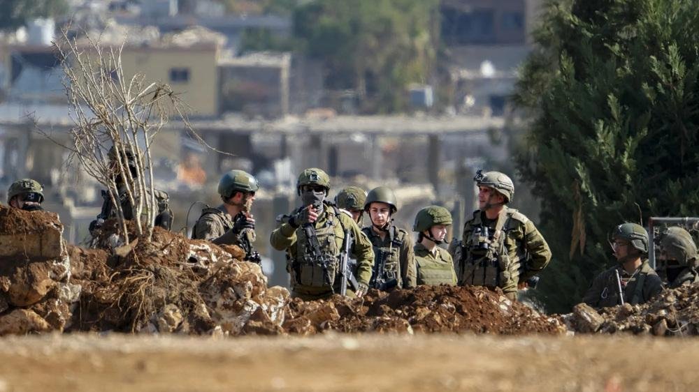 Israel keeps some troops in southern Lebanon in defiance of withdrawal deadline